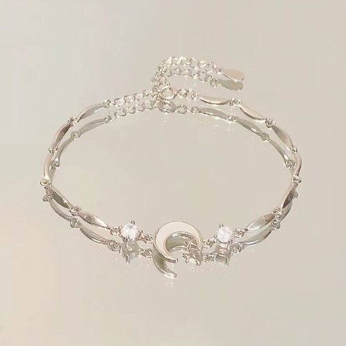Image of Elegant Silver-Tone Zircon Bracelet with Moon, Cherry & Butterfly Pendant – Shiny Crystal Fashion Bangle for Women and Girls