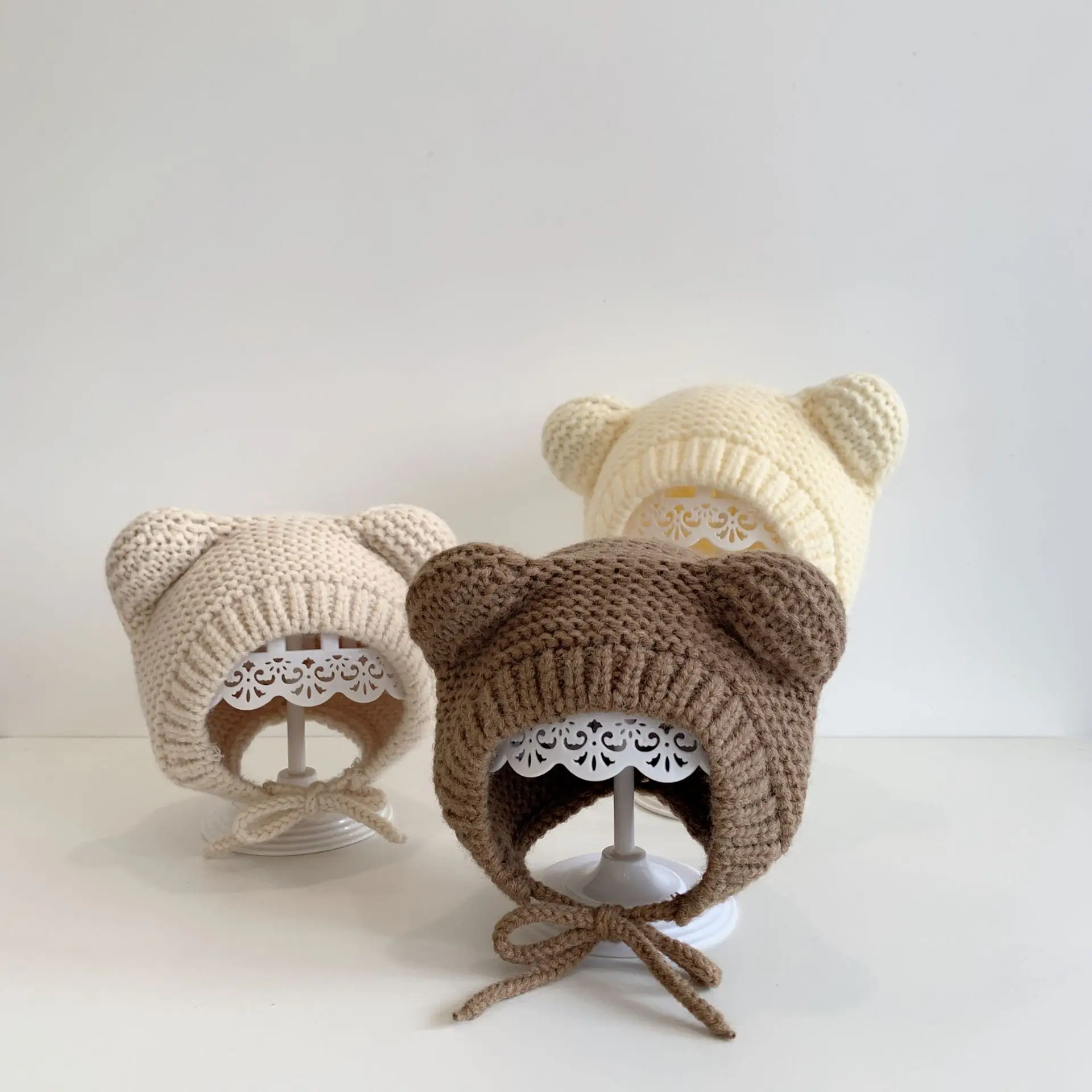 Image of Cozy Korean-Style Baby Knit Hat with Ear Protection, Warm Winter Pullover Moonsuit & Matching Poncho Set for Infants