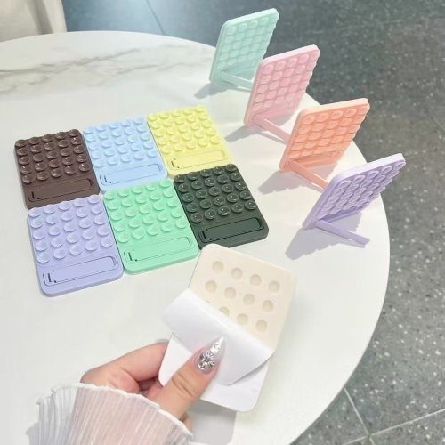 Immagine di Supporto per telefono con ventosa in silicone Tappetino per ventosa multifunzionale Supporto da parete in metallo antiscivolo Supporto per custodia a mani libere Adesivo posteriore