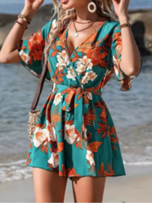 Afbeelding van Losse, hoog getailleerde jumpsuit met korte mouwen en V-hals – bedrukte damesjumpsuit voor strandvakantie en comfortabele zomerkleding