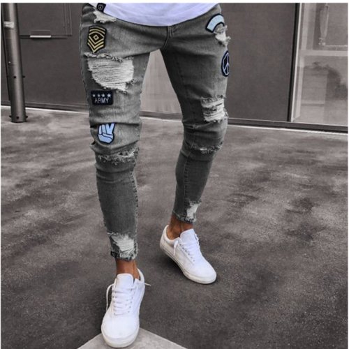 Afbeelding van Herenslank Fit Stretch Jeans met Ripped Details, Cartoon Print en Borduurwerk – Zwarte Hip Hop Denim Broek met Vernietigde Gaten