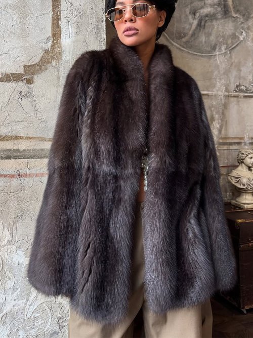 Image of Elegant Medium-Length Faux Fur Coat for Women with Lapel Design, Hidden Buttons, and Loose Fit – Stylish Warm Outerwear for Office and Commute 2025