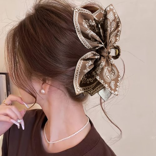 Immagine di Fermaglio per capelli elegante con fiocco in legno di anacardio