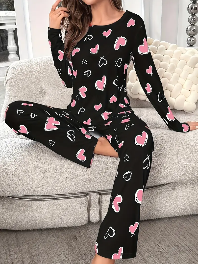 Image of Cozy Heart-Print Ribbed Pajama Set with Frill Trim – Soft Knit Sleepwear for Women Featuring Loose Fit Round Neck Top and Elastic Long Pants