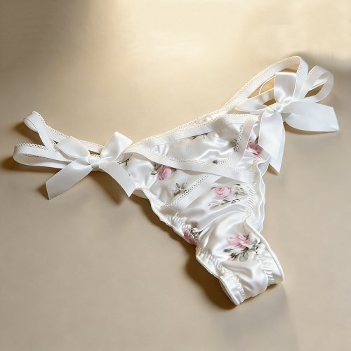 Image of Elegant Floral Printed Satin Thong Briefs with Ruffled Bow and Cross Strap Design for Women
