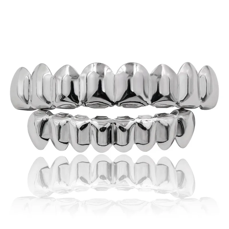 Immagine di Set di griglie superiori e inferiori con denti HIP HOP placcati in oro e argento con set di denti da vampiro veri e lucidi in silicone
