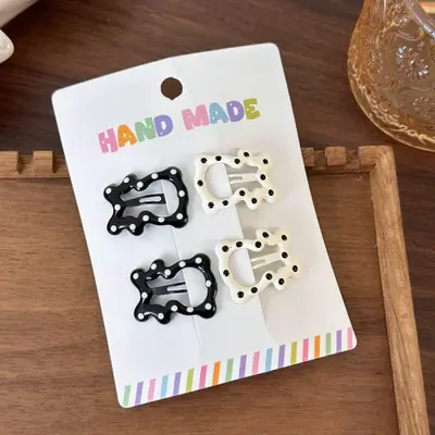 Image de Barrettes à Pois Noirs & Blancs pour Filles - Accessoires Mignons