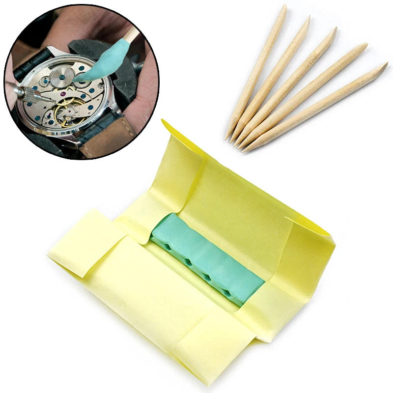 Bild von Uhrreiniger-Set mit grünem Gummikitt und Holzstäbchen – Profi-Werkzeug für Uhrmacher zur präzisen Reinigung von Uhrwerken und Uhrenteilen
