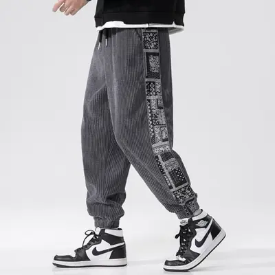 Image de Pantalon homme velours côtelé imprimé fleur de cajou style Y2K