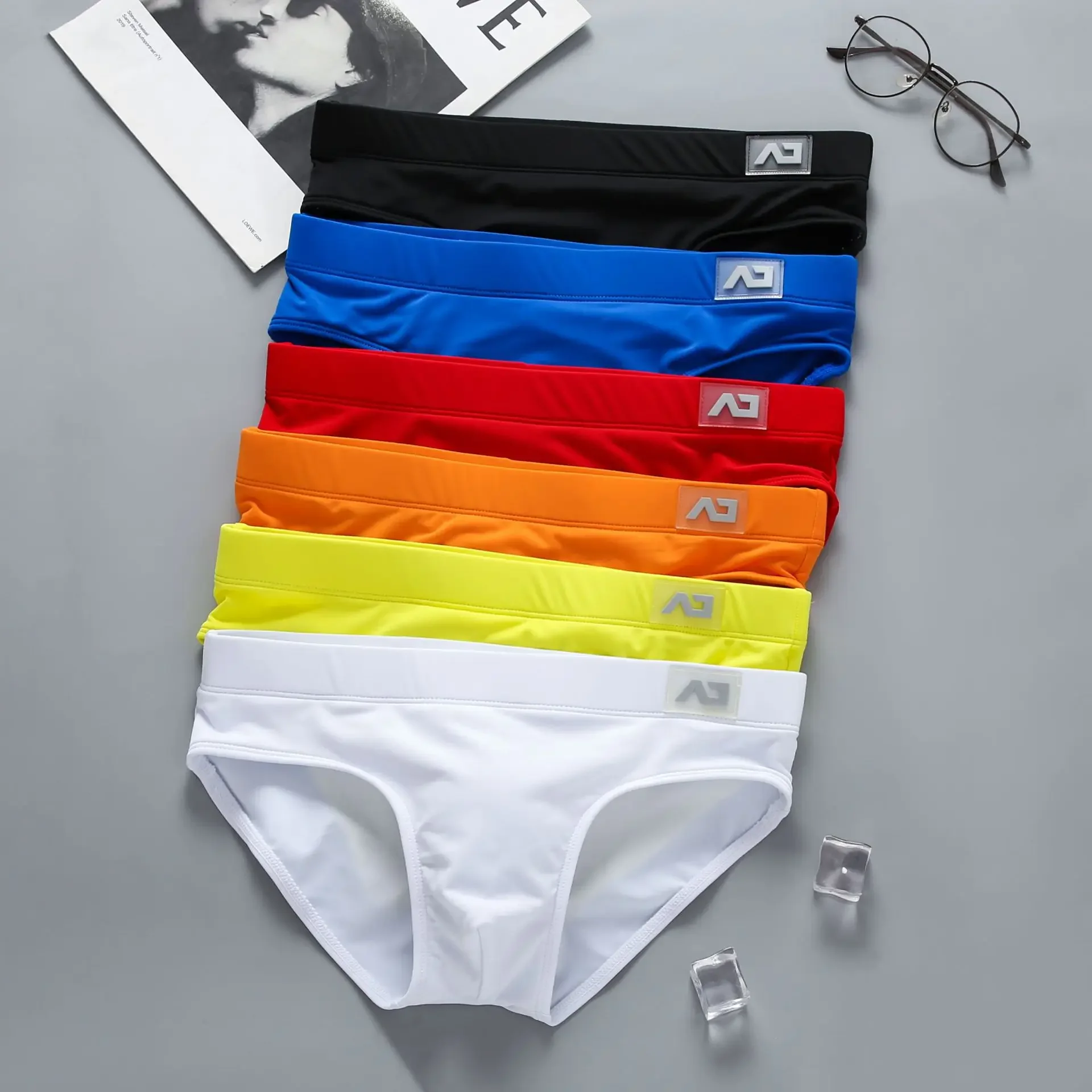Image of Men's Low Waist Quick-Dry Swim Trunks – Sexy, Anti-Embarrassment Sports Briefs for Active Young Men