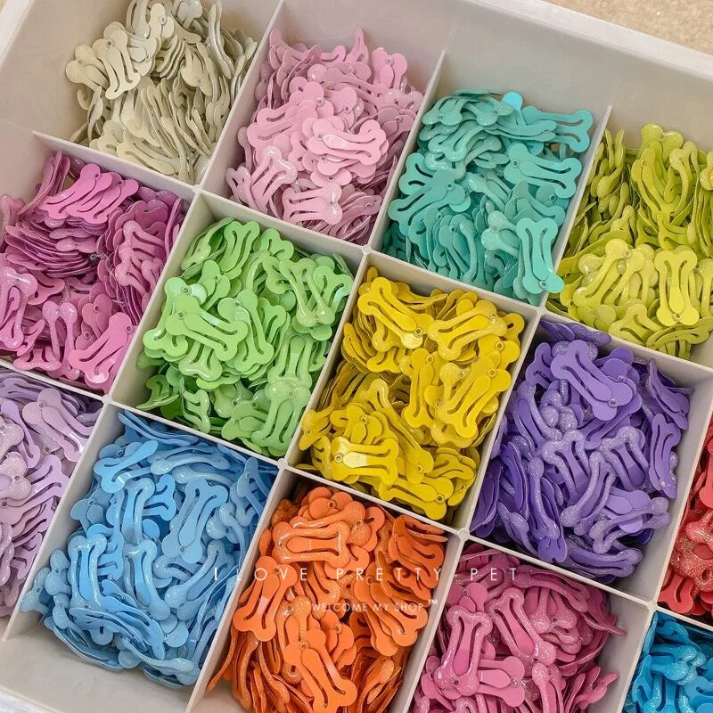 Zdjęcie Urocze spinki do włosów w kształcie kości w kolorze cukierków – 20 sztuk dla psów i kotów, stylowe akcesoria do włosów dla zwierząt domowych