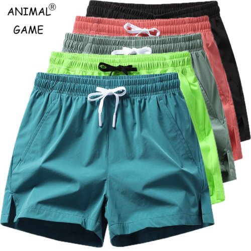 Imagen de Pantalones de chándal deportivos de verano para hombre, pantalones cortos informales con bolsillos, pantalones ligeros básicos de Color sólido, pantalones cortos de playa para correr para hombre