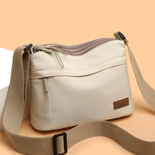 Image of Stylish High-Capacity Canvas Crossbody Bag for Women with 3 Main Pockets – Perfect Multi-Pocket Shoulder Handbag for Moms and Daily Shopping