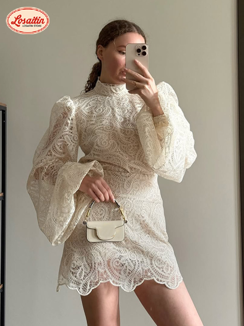 Image of Elegant White Lace Two-Piece Set with Long Flare Sleeve Top and High-Waisted Mini Skirt for Women – Perfect for Casual, Party, or Holiday Outfits