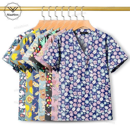 Afbeelding van Hoge Kwaliteit Medische Blouses & Chirurgische Jassen - Comfortabele Scrubs voor Artsen, Verpleegkundigen, Tandartsen en Dierenartsen met Cartoon Print